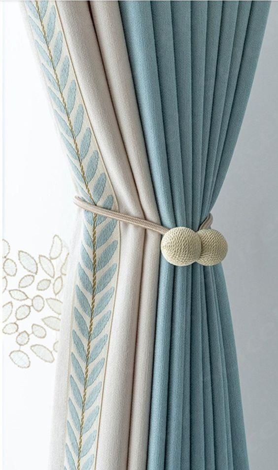 Close detail of luxury curtain tieback and tassel